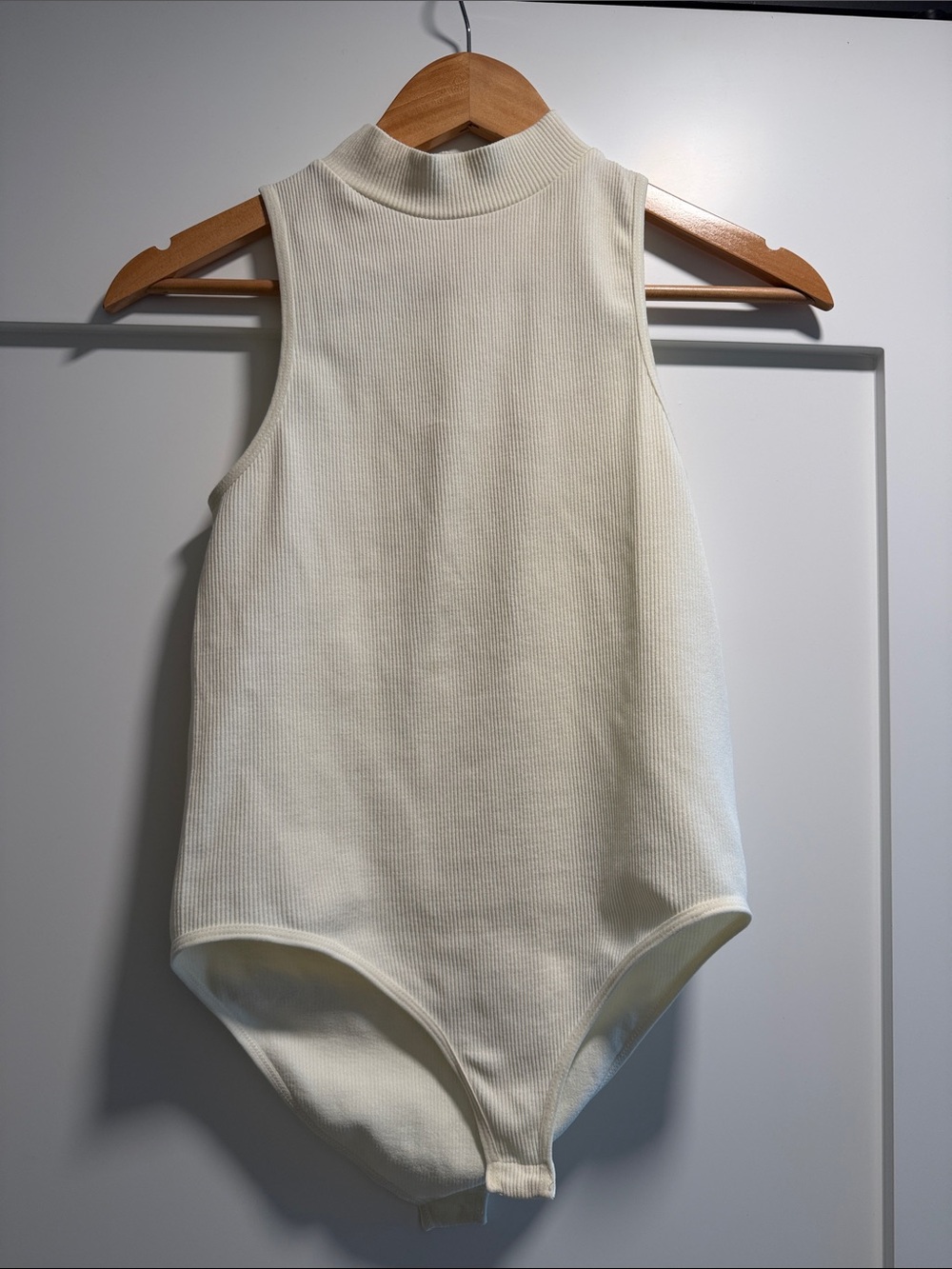 Cream Ribbed Mock Neck One-Piece Bodysuit